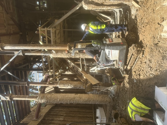 Piling rig working in a confined excavation beneath temporary support