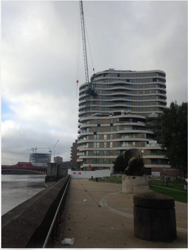 Completed building with tower crane